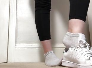 Student showing her stan smiths and socks