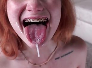 Scarlet Skies cute redhead still in braces loves sucking big dicks.