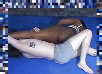 Black chick wrestling a white guy and beating him up