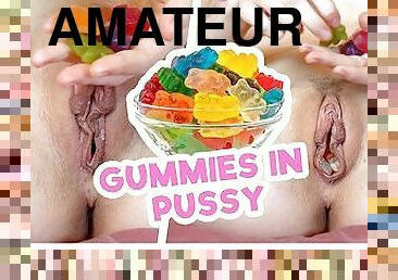 Teen makes gummies dirty in pussy juices by stuffing them inside