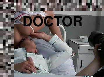 Erotic photo session of doctor Jayden James with a cock in his mouth