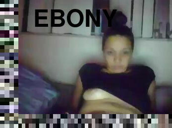 Ebony masturbates on bed