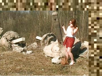 Pissing on a rock is a cute redhead
