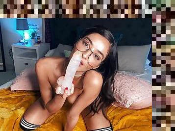 A nerdy babe in glasses fucks herself in the ass for your enjoyment