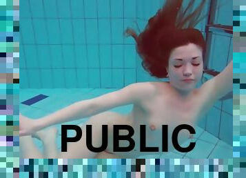 The pretty young Polish girl Alice swimming without clothes