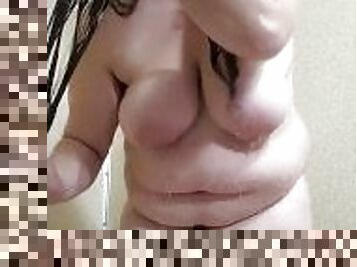 Brunette Brushing Her Hair in the Shower.