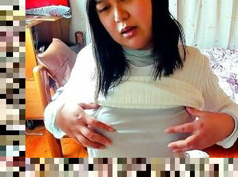 A busty Japanese woman enjoys masturbating her nipples through her see-through top.