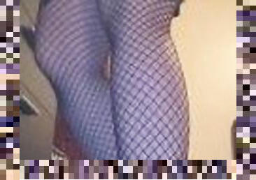 Goth girl sways in fishnets