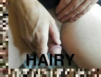 Circumcised white hairy cock sits and plays with penis