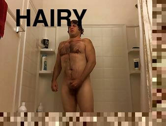 Hairy stud masturbates in the shower voyeur