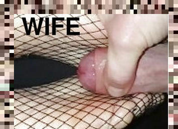 The wife giving me a footjob in fishnet stockings