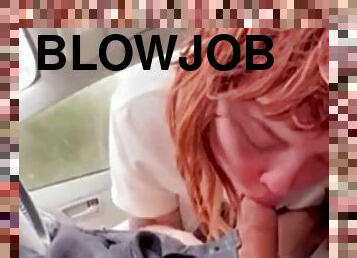 Red-haired girlfriend gives blowjob in the car