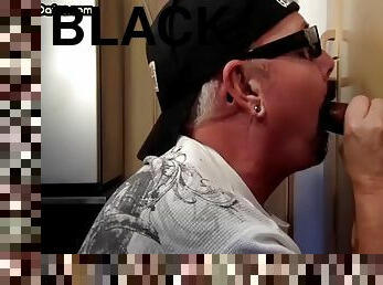 Real Gloryhole DILF sucks a black cock with great pleasure