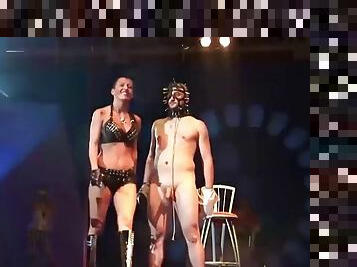 Extreme fetish show on public show stage