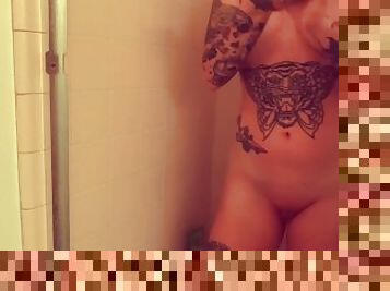 Tattooed MILF fingers herself & cums in shower