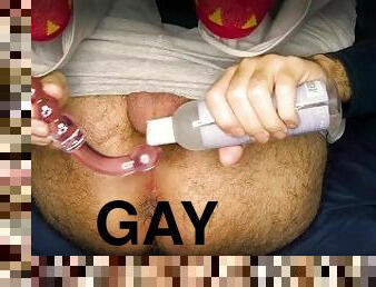 Guy with colorful socks makes glass dildo dissapear