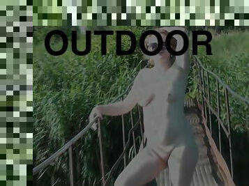 Messalina Dressed In Sun. Outside Outdoor. Nude Milf Walks By Bridge River. Naturist Nudist Woman