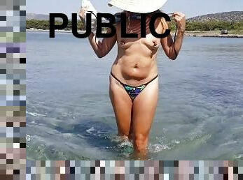 nippleringlover topless in shallow waters at public beach flashing large gauge nipple piercings