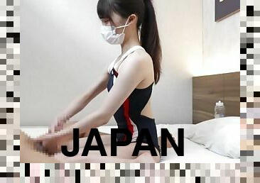 Japanese kawaii girl gives a guy a hand job wearing swimsuits