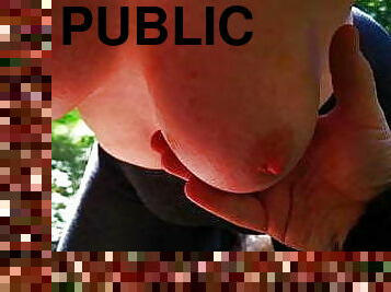 Milking big tits in public