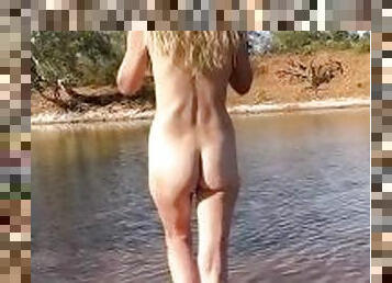 Exhibitionist hotwife goes skinny dipping outdoors