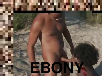 Ebony enjoying sex with white guy on the beach