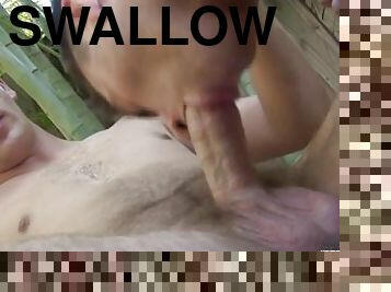Handsome dude sucks with passion his boyfriend big cock and swallows cum outdoor