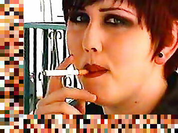 Goth girls smoke and talk at home