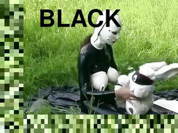 Rubber Girl Full in Black Latex Catsuit and Mask Plays with herself Outdoor in a Meadow - Part 3