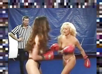 CatFight Topless female boxing as blonde battles brunette with body punches,