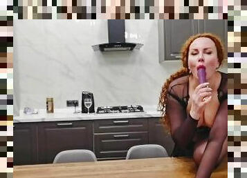 Sexy mom dances in the kitchen and fucks herself with a dildo