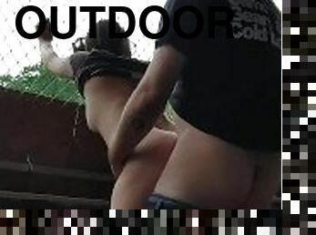 Risky outdoor fucking in a baseball dugout.