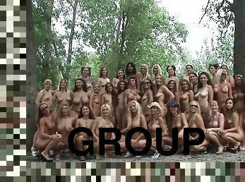 A group of naked bitches outdoors making a photoshoot