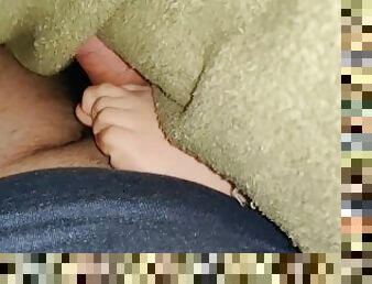 My stepsister gives a footjob under the blankets while watching a movie