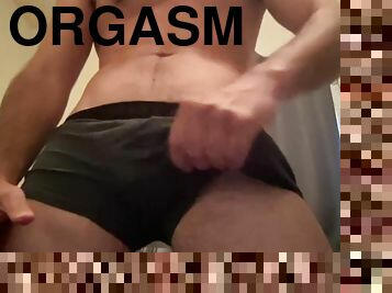 fit guy moans during stroking his big dick, has uncontrollable shaking orgasm