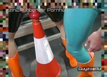 Two guys in tight shiny rubber & orange boots arse fingering, jerking each other, dildos, rimming