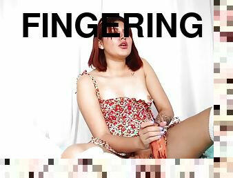 Solo teen slut in stockings fingers her pussy
