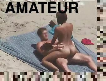 Amateur couples filmed nailing on the beach