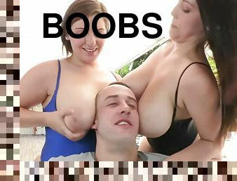 Dude relaxes on two pairs of big boobs and in two wet cunts