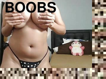 Emily sucks on a dildo and reveals her big brown boobs