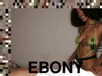 Tattooed ebony masseuse babe in bikini gives oral sex session