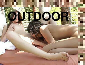Two stunning brunettes enjoy pussy licking scene outdoors