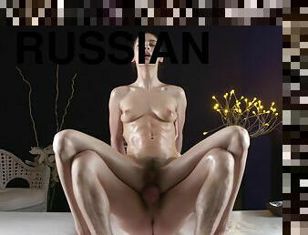 Tight body Russian rides a big dick during a massage room fuck session
