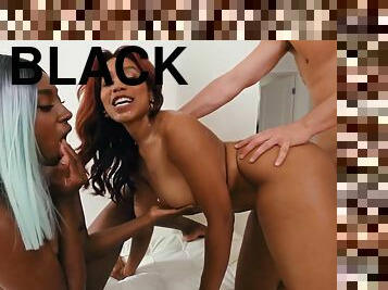 Two pretty black babes with natural tits getting fucked on the sofa