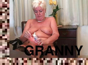 Chubby granny in stockings plays with vibrator