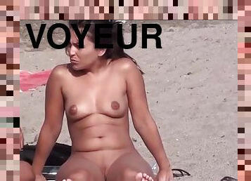 Voyeur comes to the nudist beach and films a naked girl