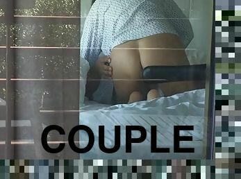 Filming a hot couple having sex while looking out the hotel window