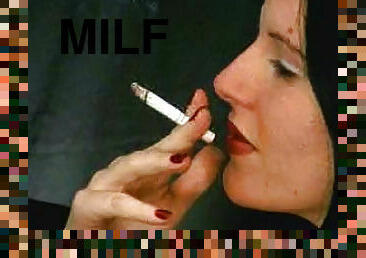 Pretty girl smokes cigarette sensually