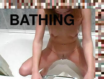 Pissing and showering in bathroom