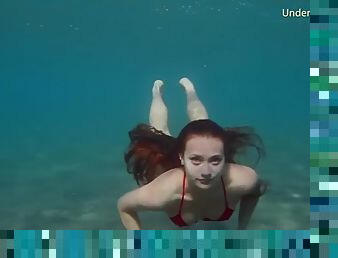 Underwater show of erotic young models in the water